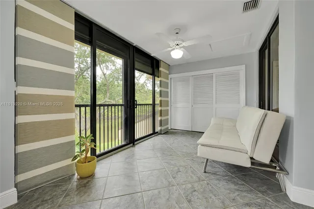 a view of staircase with white walls and windows