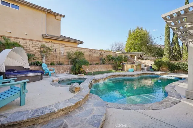 a view of a swimming pool with a patio