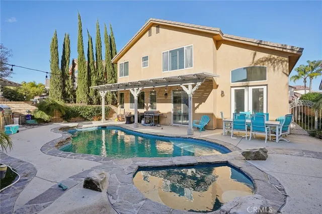 a view of a swimming pool with a patio