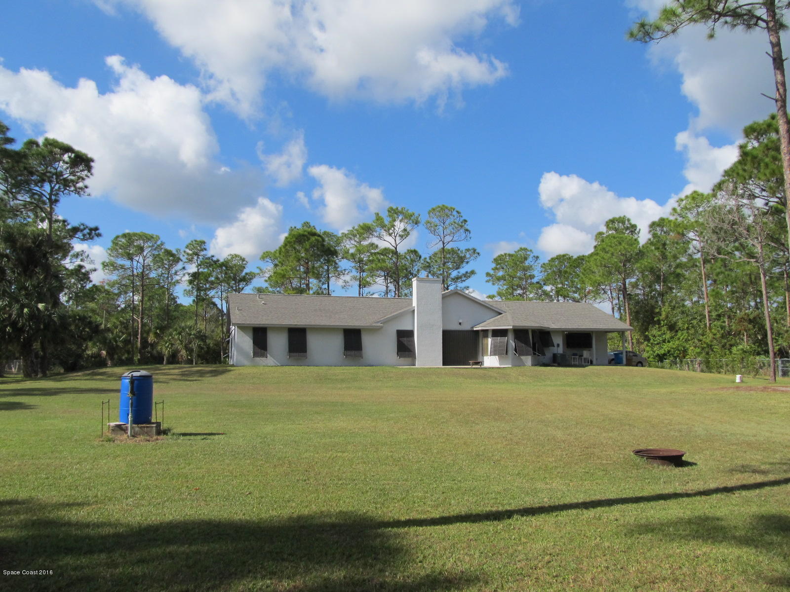 3775 Corey Road Grant Valkaria, FL 32950 - Photo 6 of 12 a front view of a house with garden