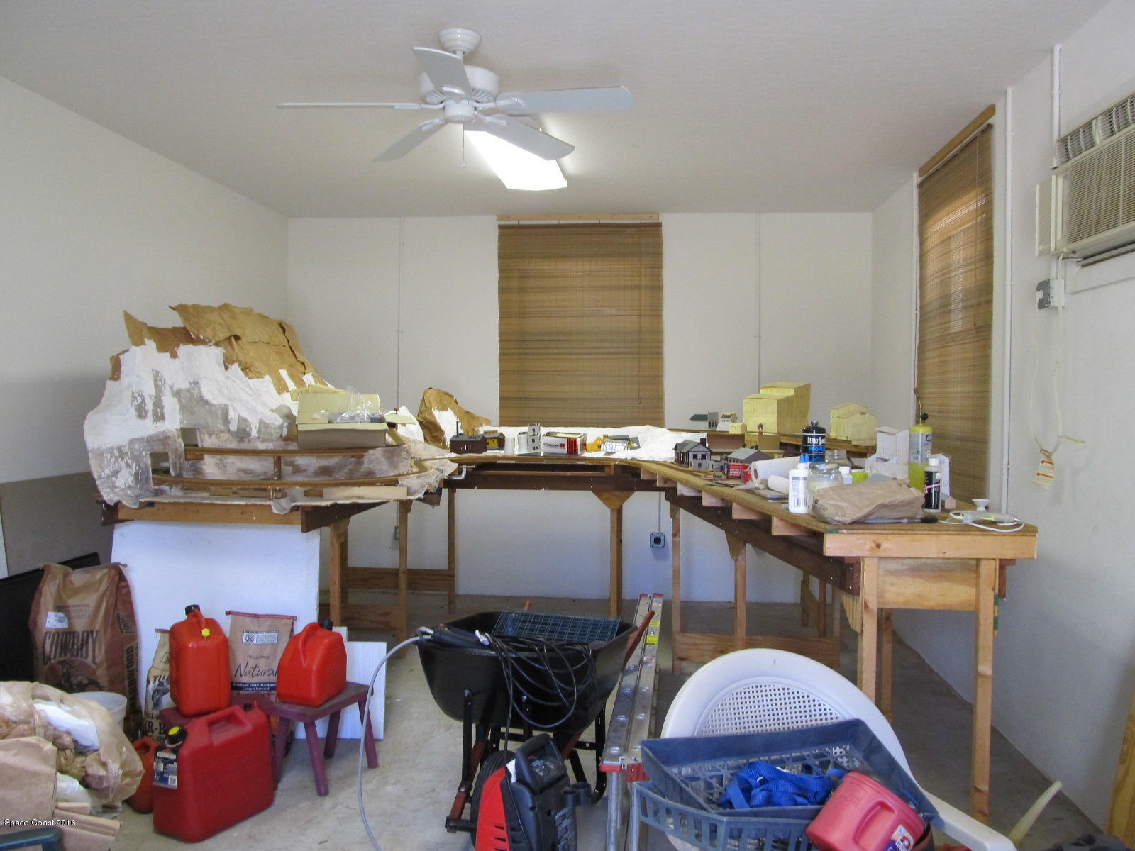 3775 Corey Road Grant Valkaria, FL 32950 - Photo 10 of 12 a room with chandelier fan and wooden floor