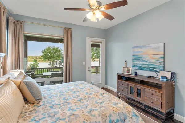 a bedroom with a large bed and a window