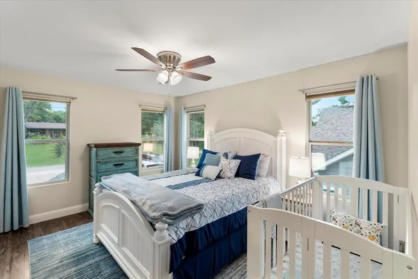 a very nice looking bedroom with a large bed and a window