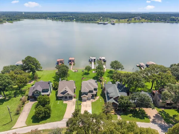 an aerial view of a house with a lake view