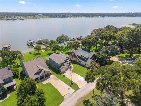 an aerial view of a house with a lake view