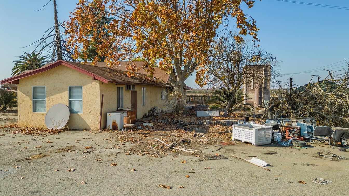 32015 Ave 10 Madera, CA 93636 - Photo 7 of 24 a front view of a house with a yard