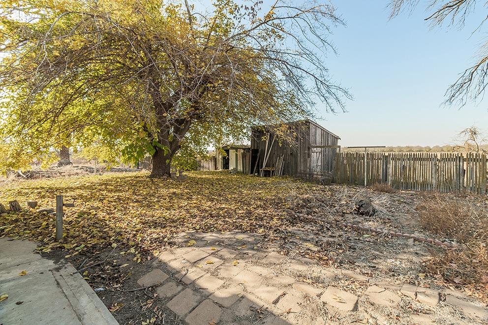32015 Ave 10 Madera, CA 93636 - Photo 8 of 24 a view of a yard with wooden fence