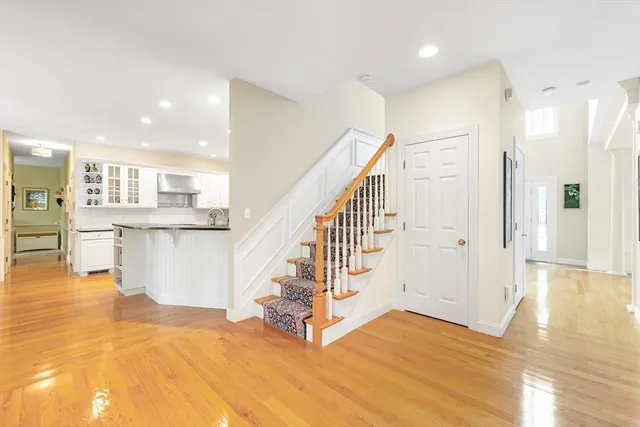 a view of a kitchen with furniture and an empty room