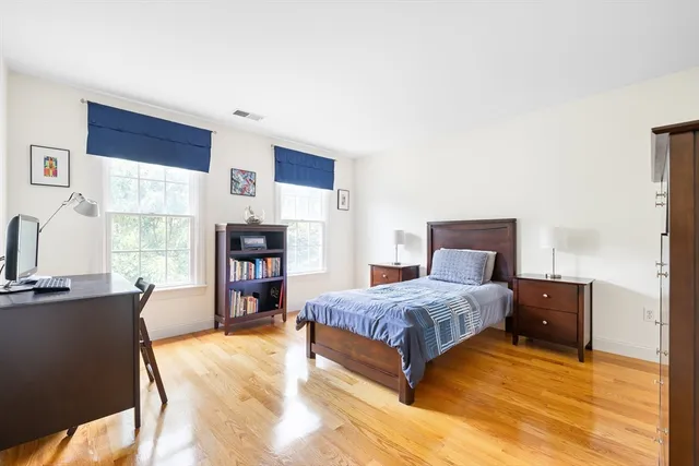 a bedroom with a bed and furniture