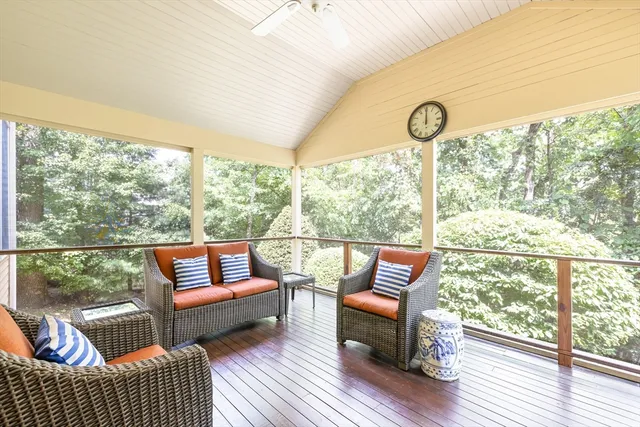 a view of a chairs and table in the balcony