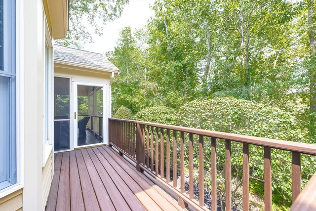 a view of balcony with wooden floor