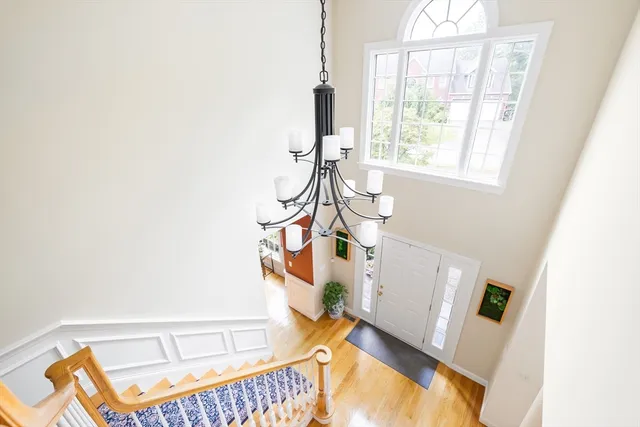 a view of an entryway with wooden floor