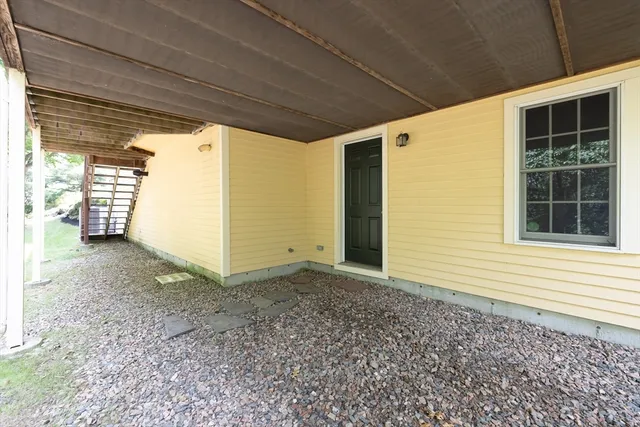 a view of a house with a backyard