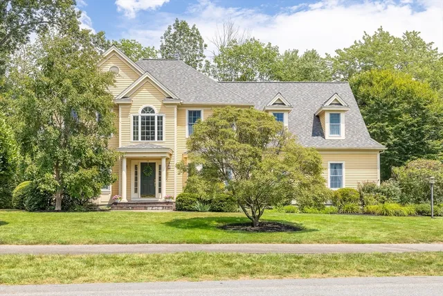 a front view of a house with a yard
