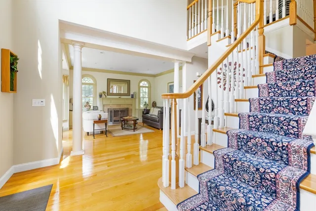 a view of an entryway with a dining table and a chandelier
