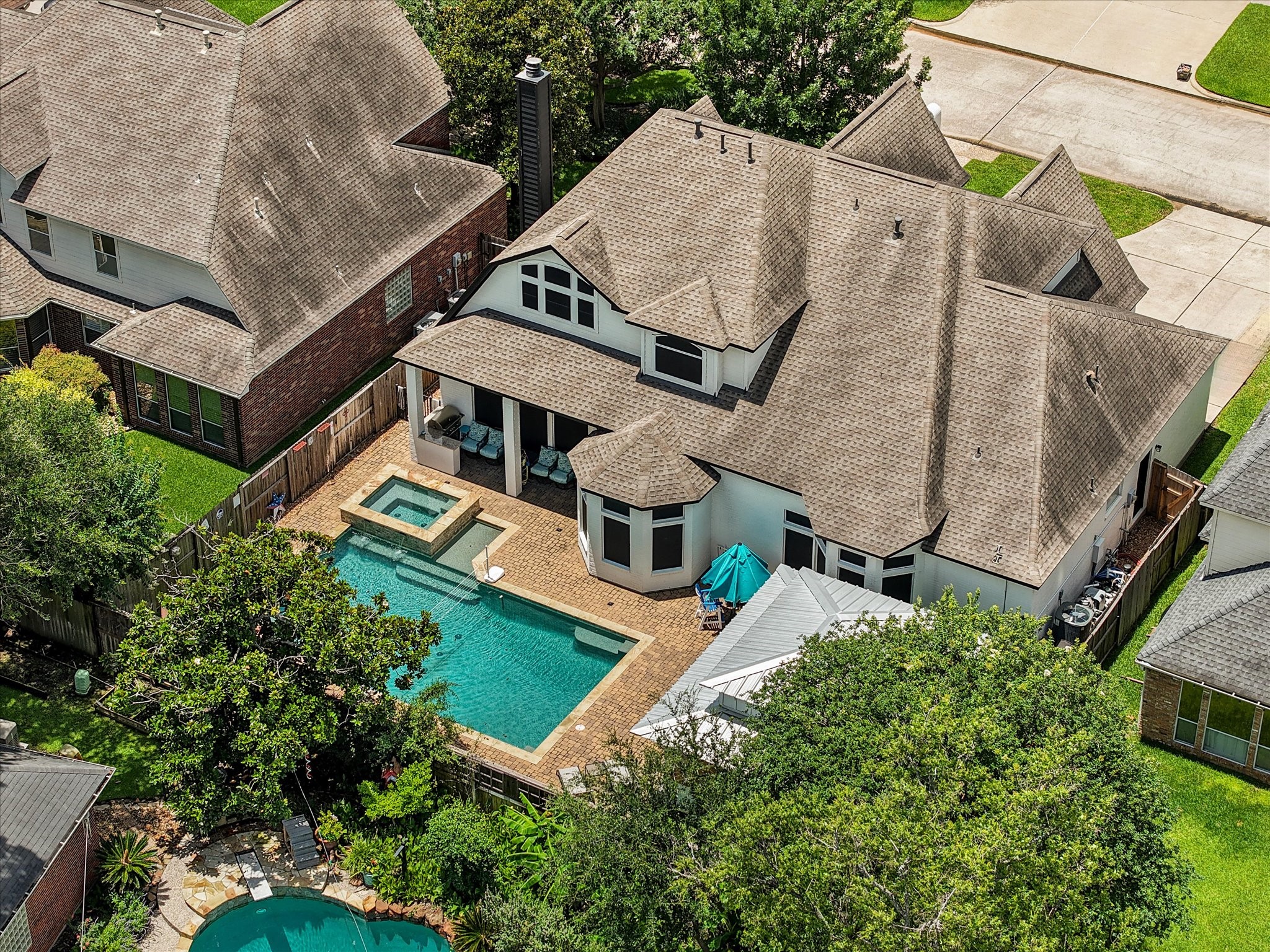 5910 Center Ct Drive Spring, TX 77379 - Photo 46 of 50 With 4 bedrooms, 3.5 baths, and nearly 4,000 square feet of beautifully updated living space, this remarkable property is anchored by a backyard retreat featuring a resort-style pool, spa, and expansive pavilion.