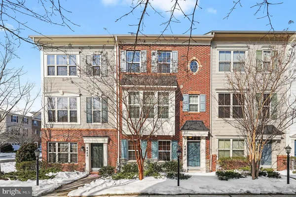 a front view of a building with a lot of windows