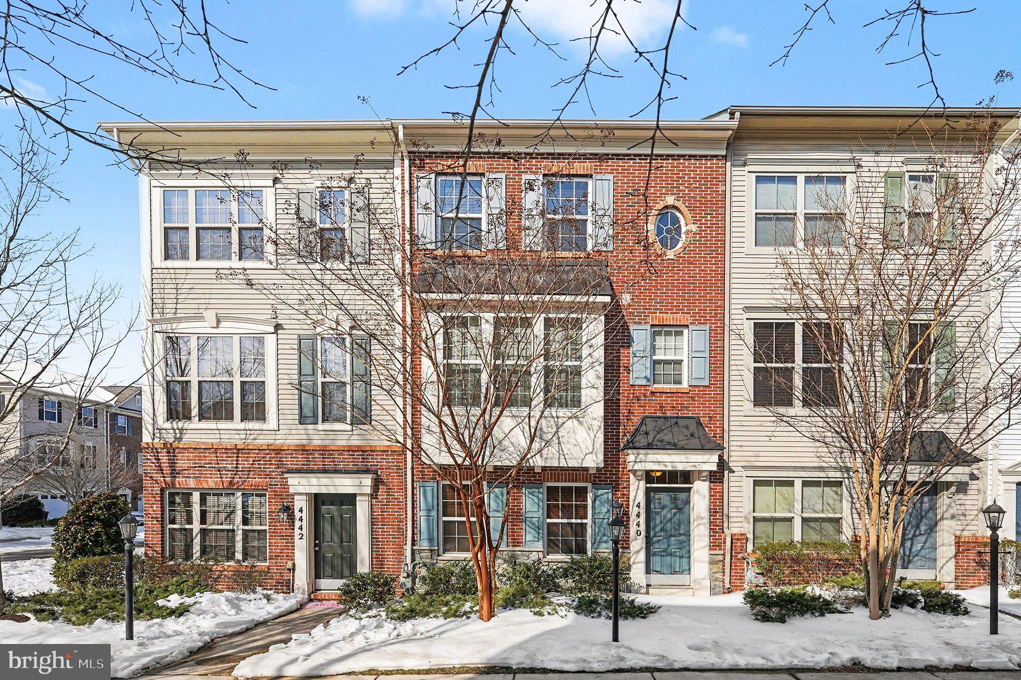 a front view of a building with a lot of windows