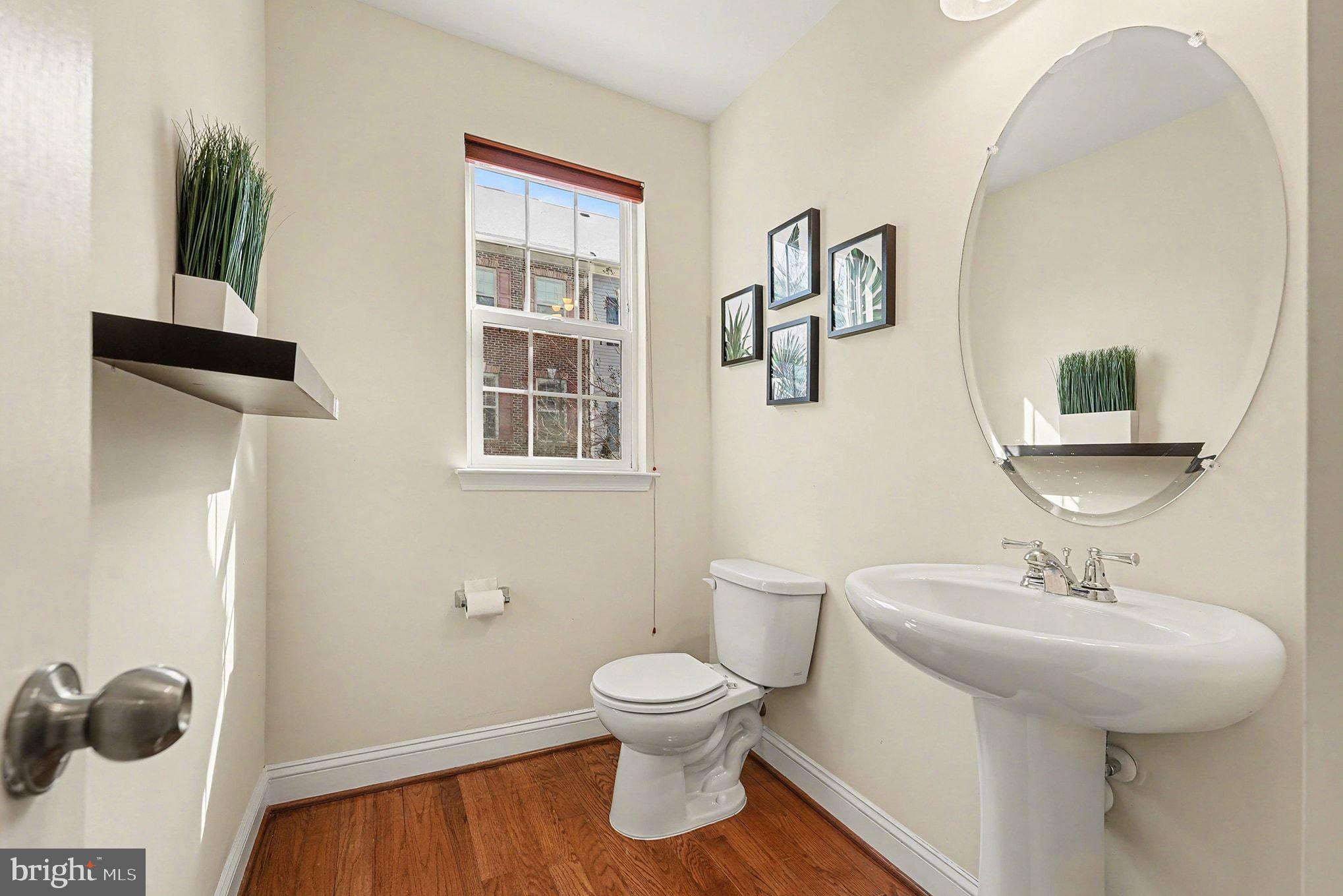 4440 Potomac Highlands Circle Triangle, VA 22172 - Photo 15 of 34 a bathroom with a toilet sink and mirror