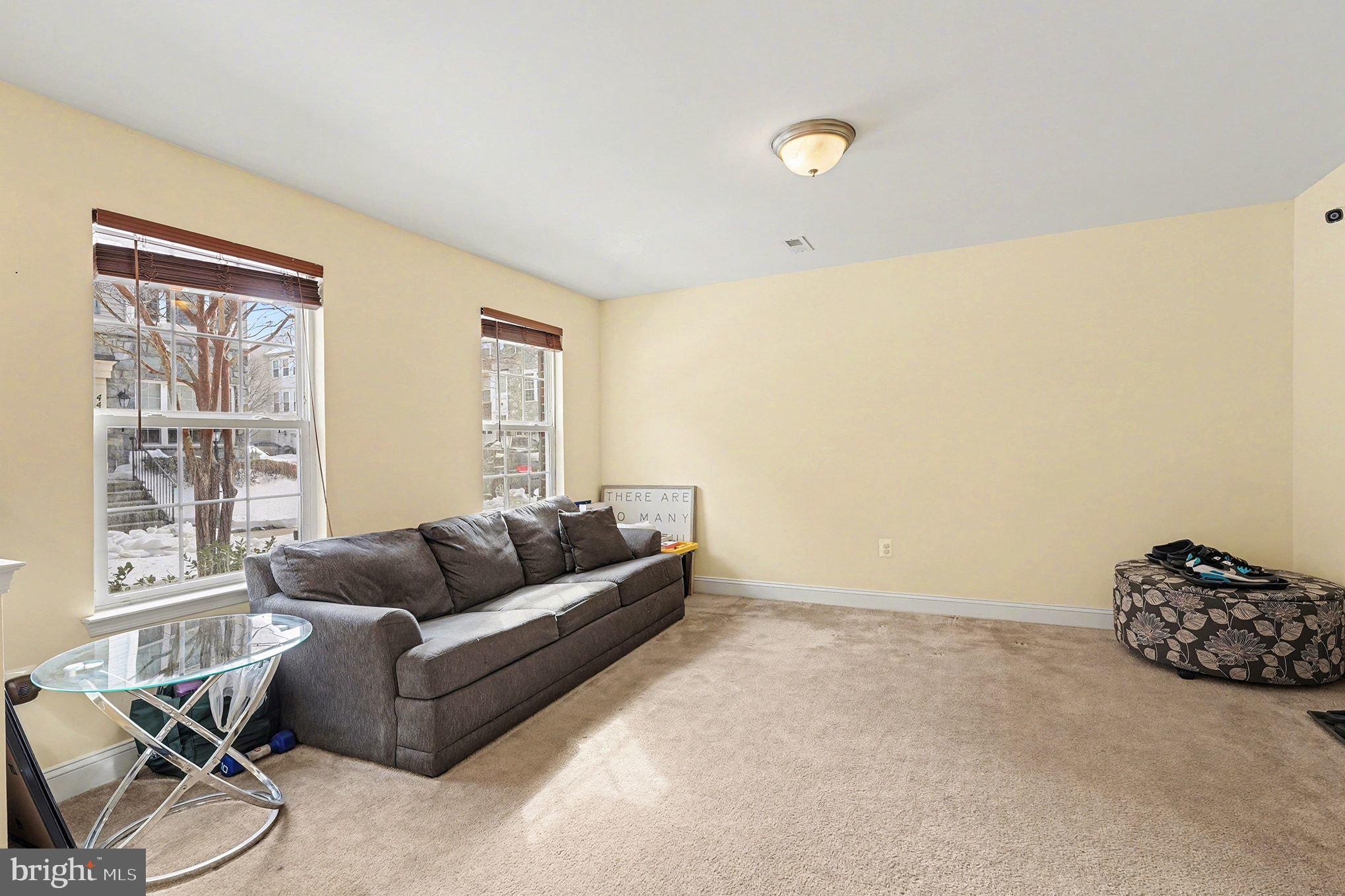 4440 Potomac Highlands Circle Triangle, VA 22172 - Photo 16 of 34 a living room with furniture and a window