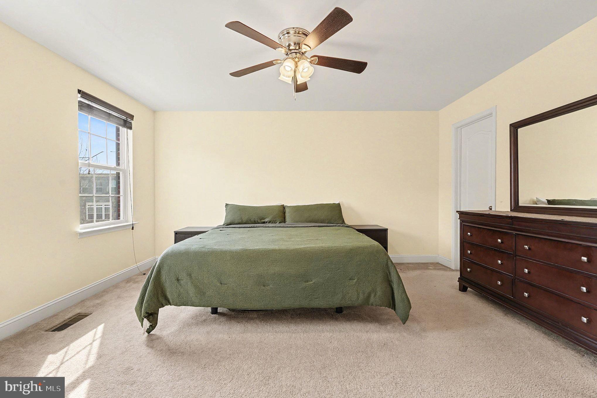 4440 Potomac Highlands Circle Triangle, VA 22172 - Photo 19 of 34 a bedroom with a bed and window