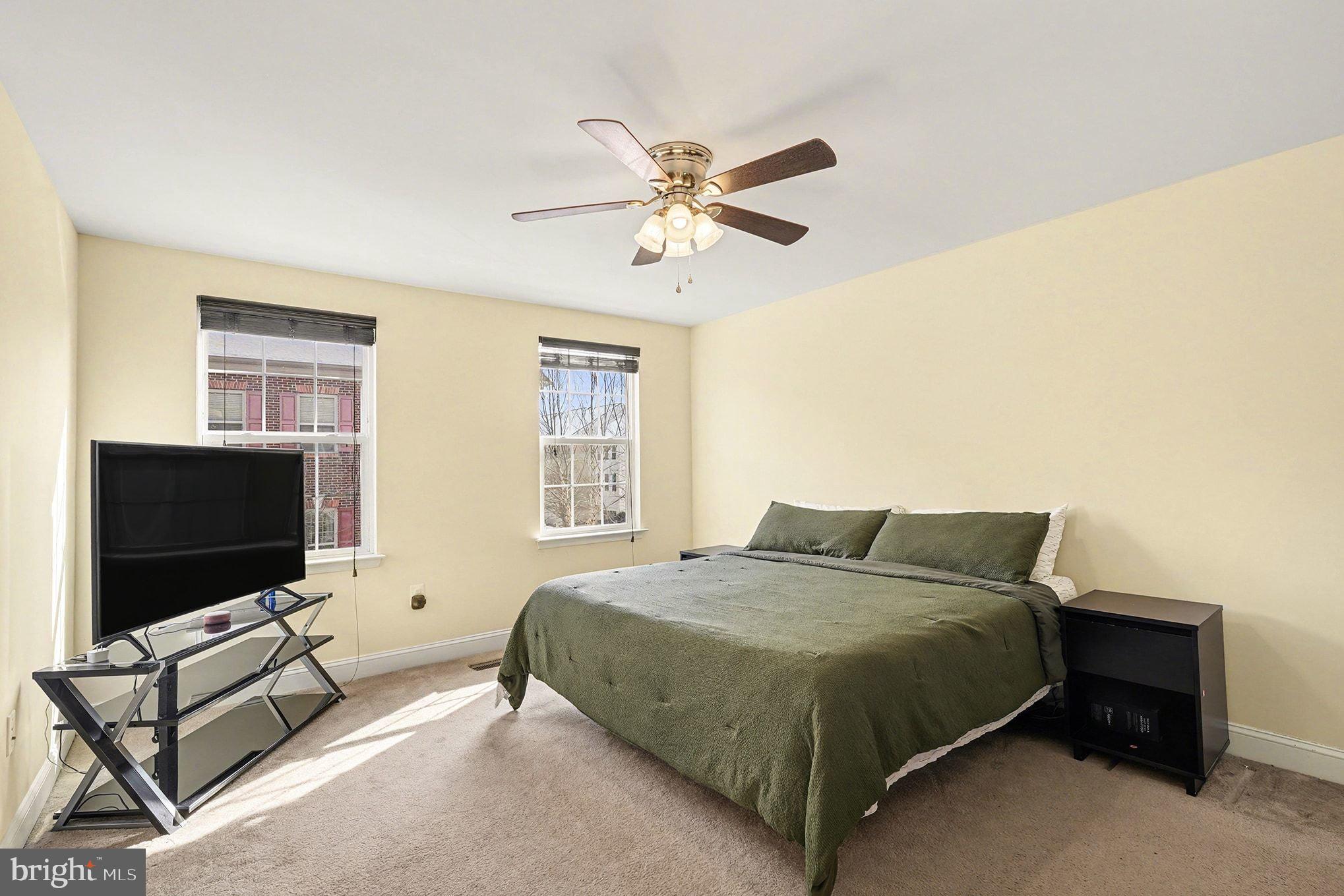 4440 Potomac Highlands Circle Triangle, VA 22172 - Photo 20 of 34 a bedroom with a bed and a flat screen tv
