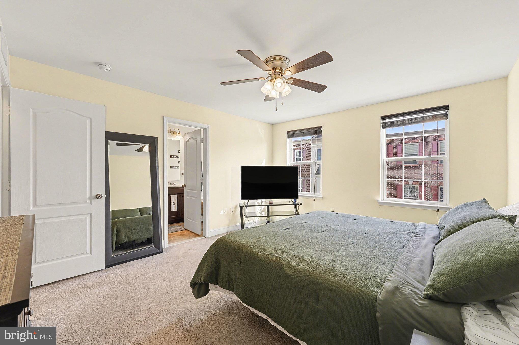 4440 Potomac Highlands Circle Triangle, VA 22172 - Photo 21 of 34 a bedroom with a bed and a mirror