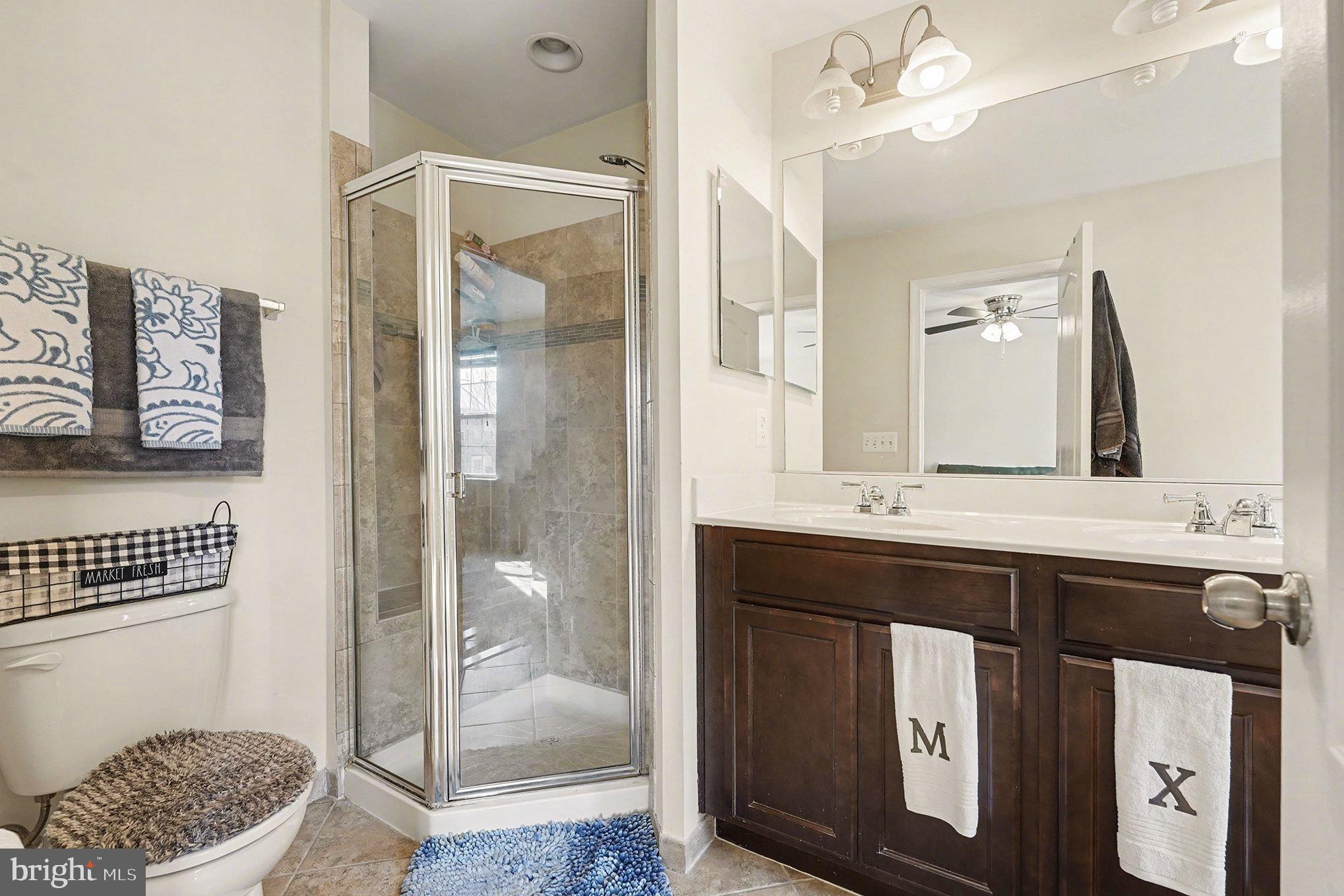 4440 Potomac Highlands Circle Triangle, VA 22172 - Photo 23 of 34 a bathroom with a sink a toilet and shower