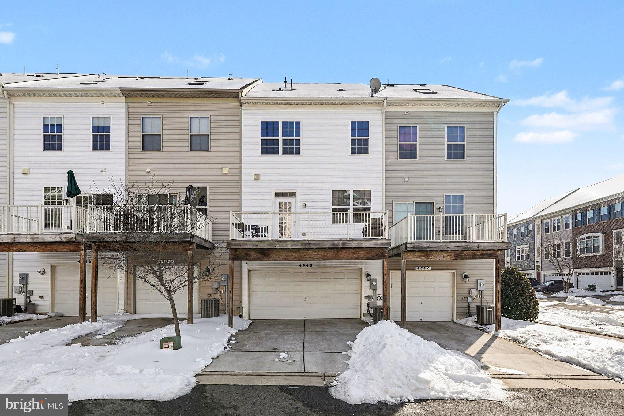 4440 Potomac Highlands Circle Triangle, VA 22172 - Photo 4 of 12 a kitchen with stainless steel appliances kitchen island granite countertop a sink and cabinets