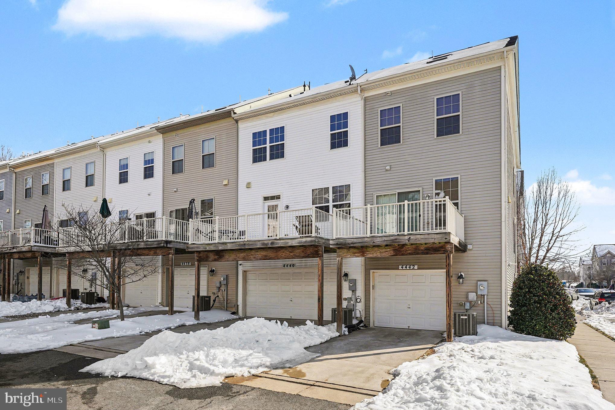 4440 Potomac Highlands Circle Triangle, VA 22172 - Photo 5 of 12 a large white building with a view of the balcony