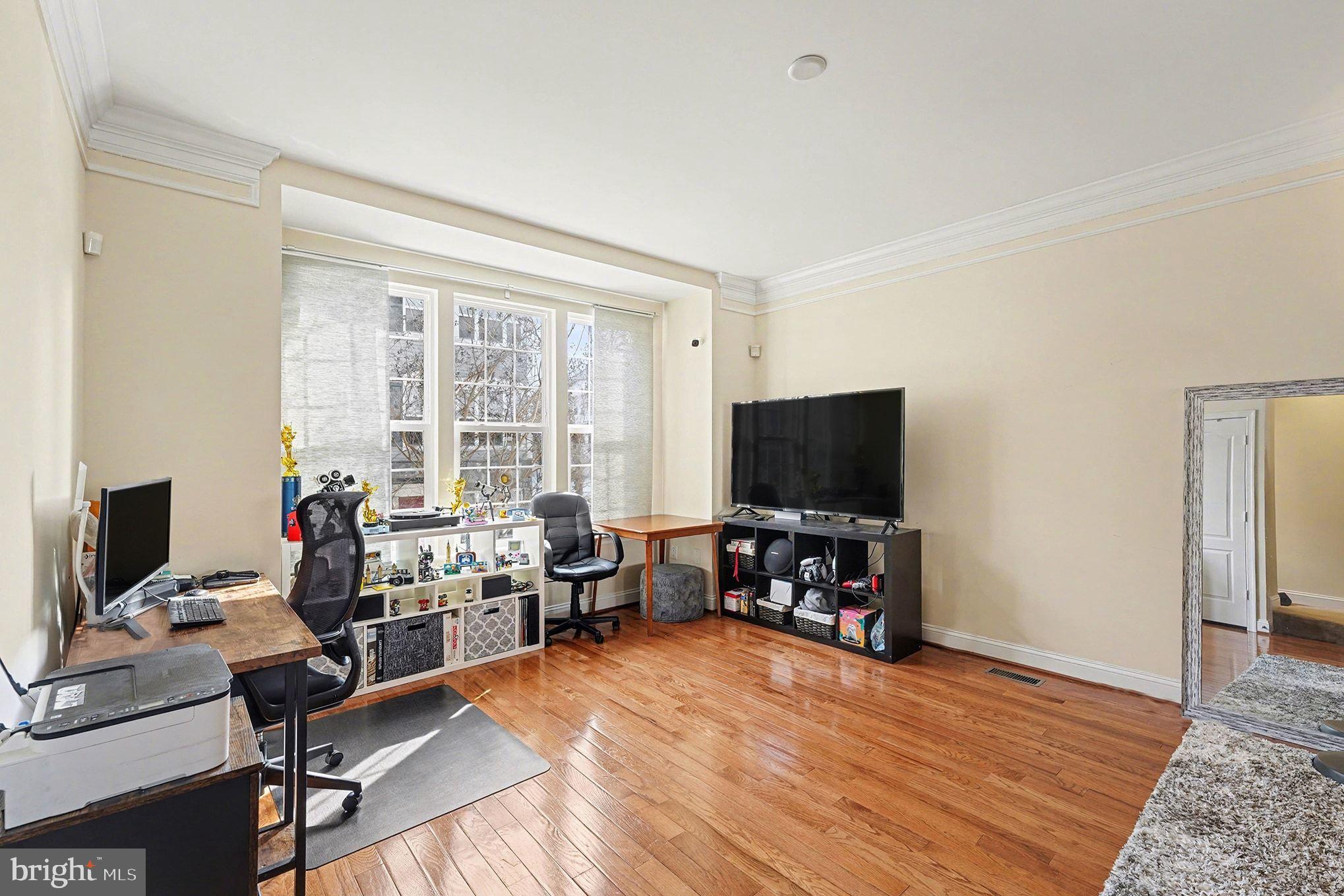 4440 Potomac Highlands Circle Triangle, VA 22172 - Photo 6 of 34 a living room with furniture and a flat screen tv