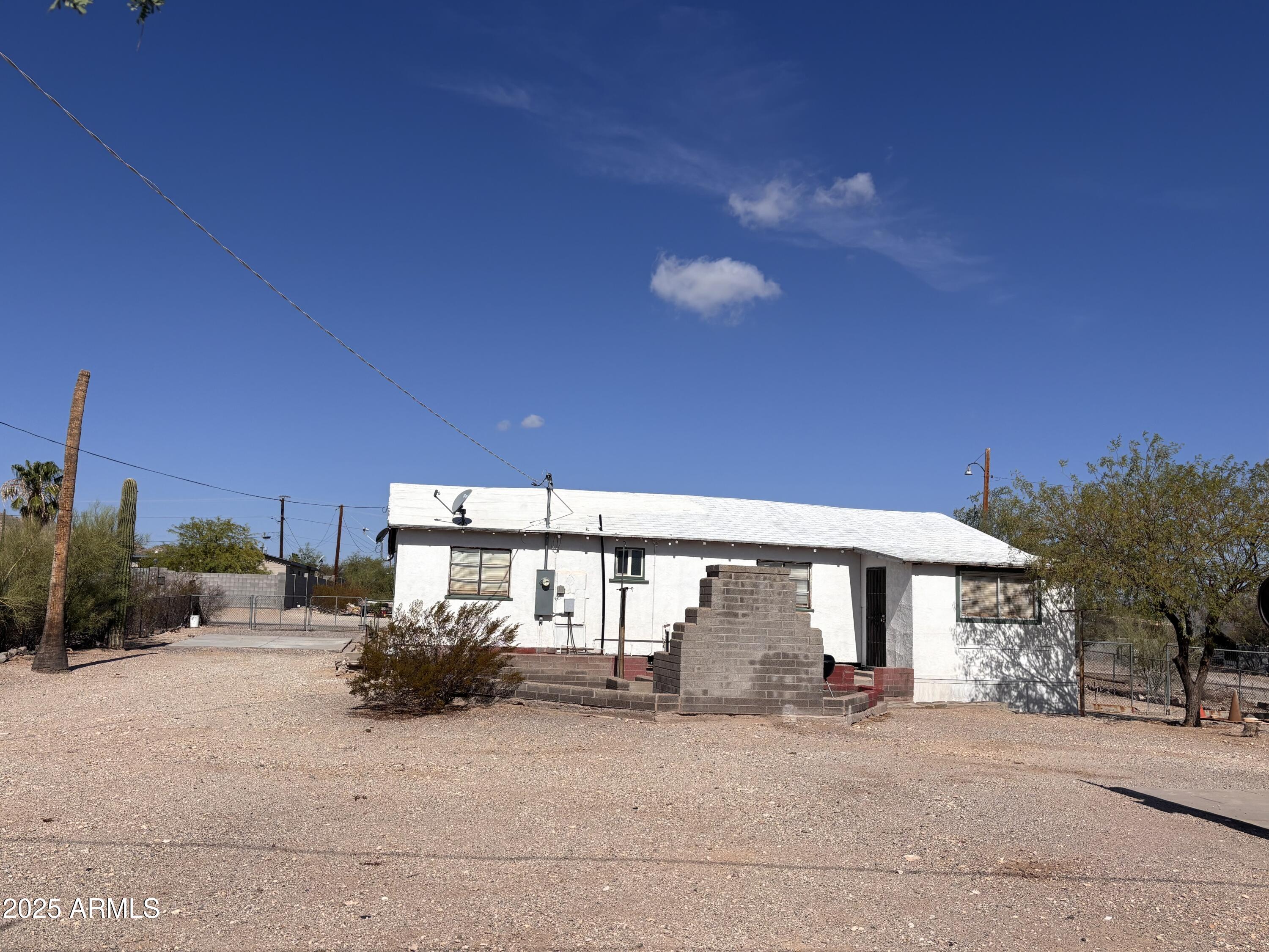 1540 North Jefferson Avenue Ajo, AZ 85321 - Photo 3 of 14 a view of a house with a patio