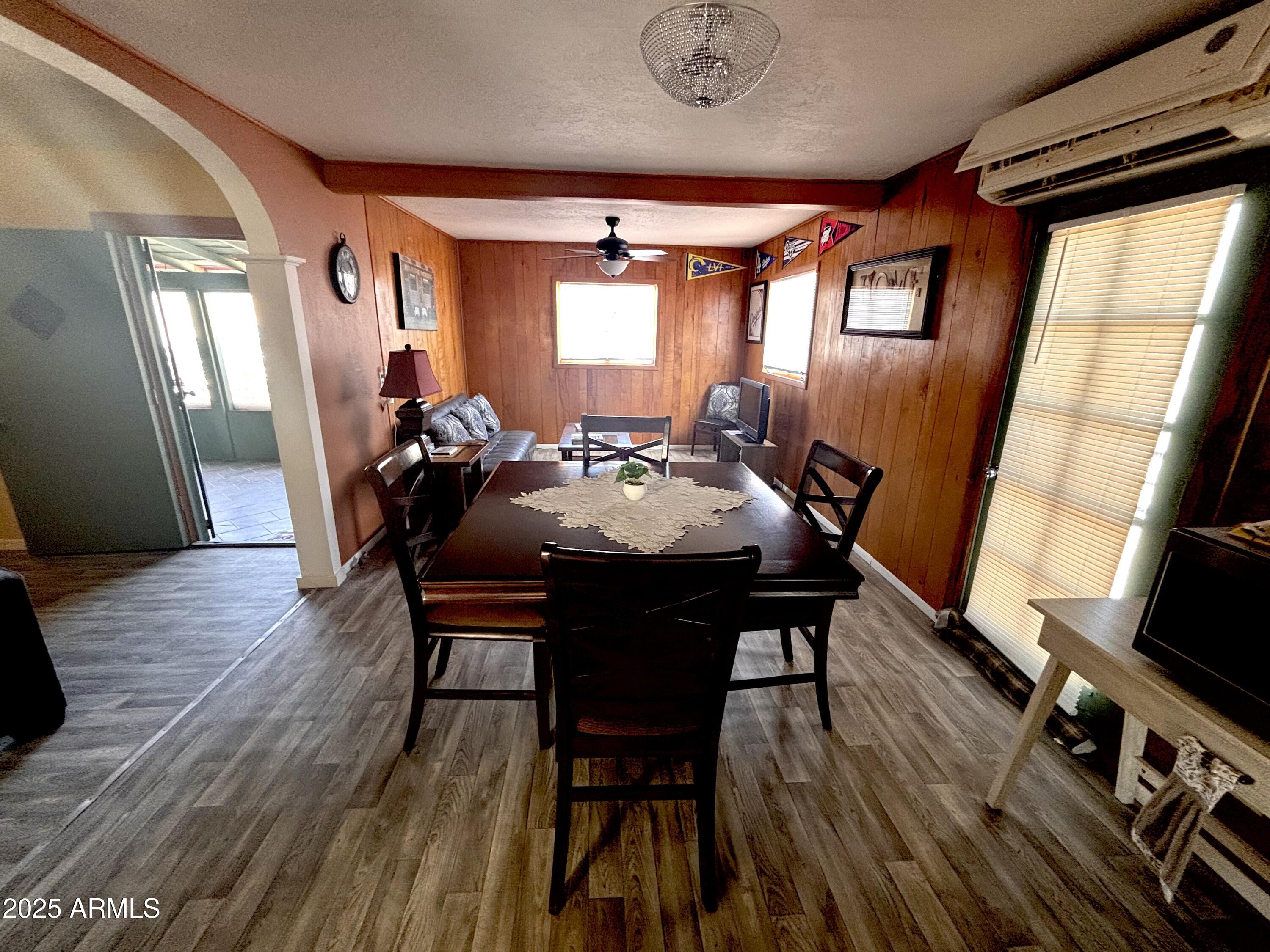 1540 North Jefferson Avenue Ajo, AZ 85321 - Photo 6 of 14 a view of a dining room with furniture window and wooden floor