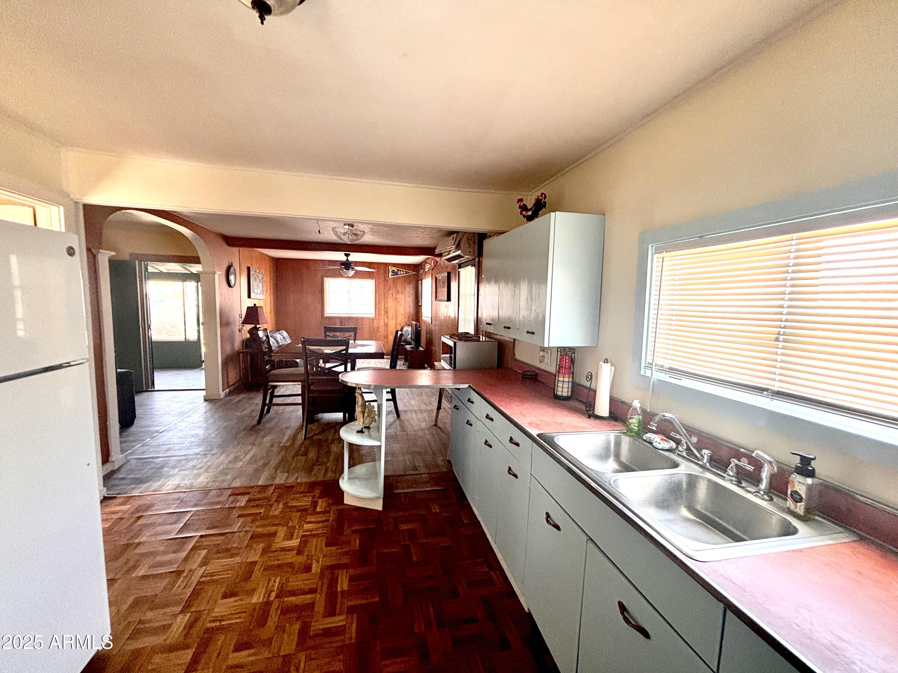 1540 North Jefferson Avenue Ajo, AZ 85321 - Photo 7 of 14 a large white kitchen with a large window