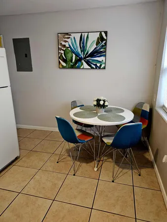 a table and chairs in a small room