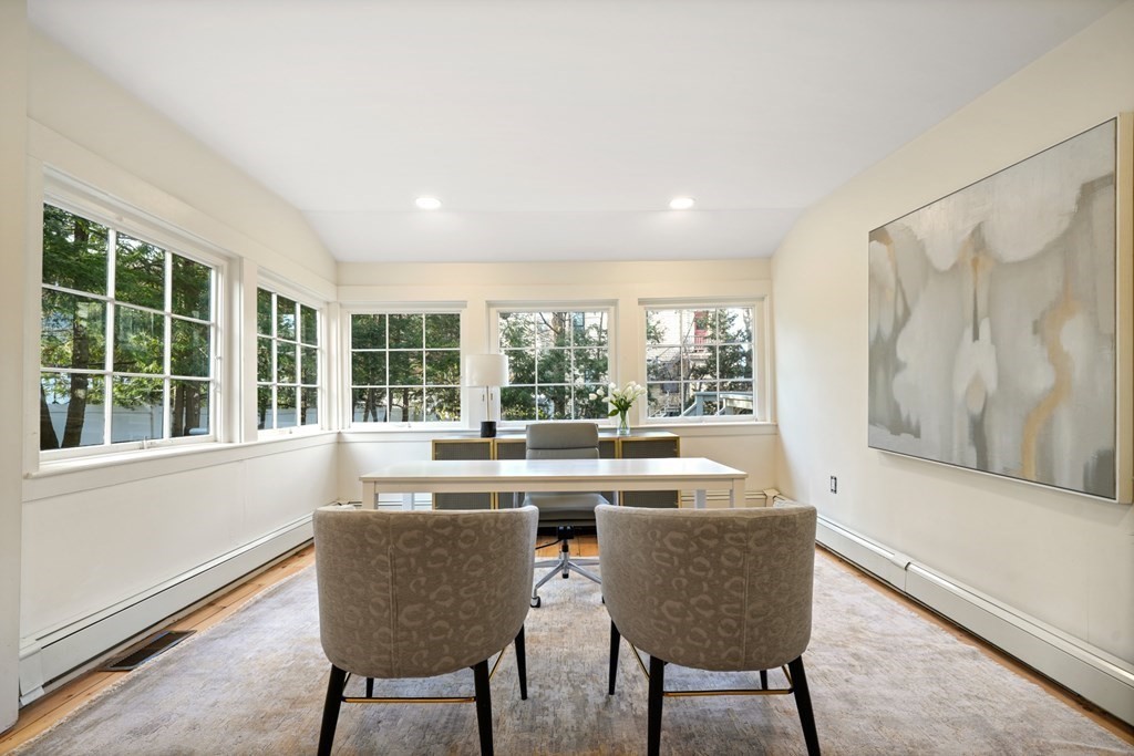 105 Eldredge Street Newton, MA 02458 - Photo 11 of 42 a dining room with furniture a chandelier and wooden floor