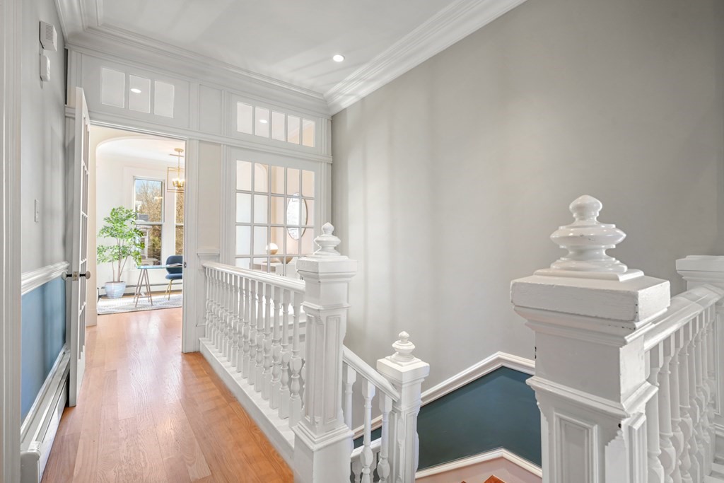 105 Eldredge Street Newton, MA 02458 - Photo 16 of 42 a view of entryway with wooden floor