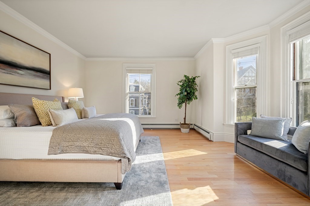 105 Eldredge Street Newton, MA 02458 - Photo 18 of 42 a living room with furniture and a large window