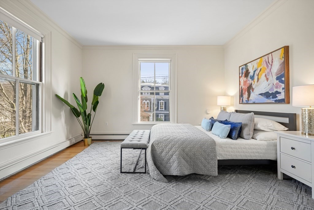 105 Eldredge Street Newton, MA 02458 - Photo 23 of 42 a bedroom with furniture and a window