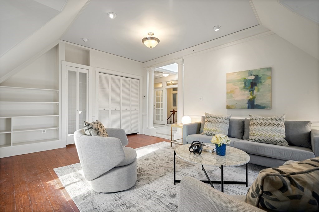 105 Eldredge Street Newton, MA 02458 - Photo 30 of 42 a living room with furniture and a window