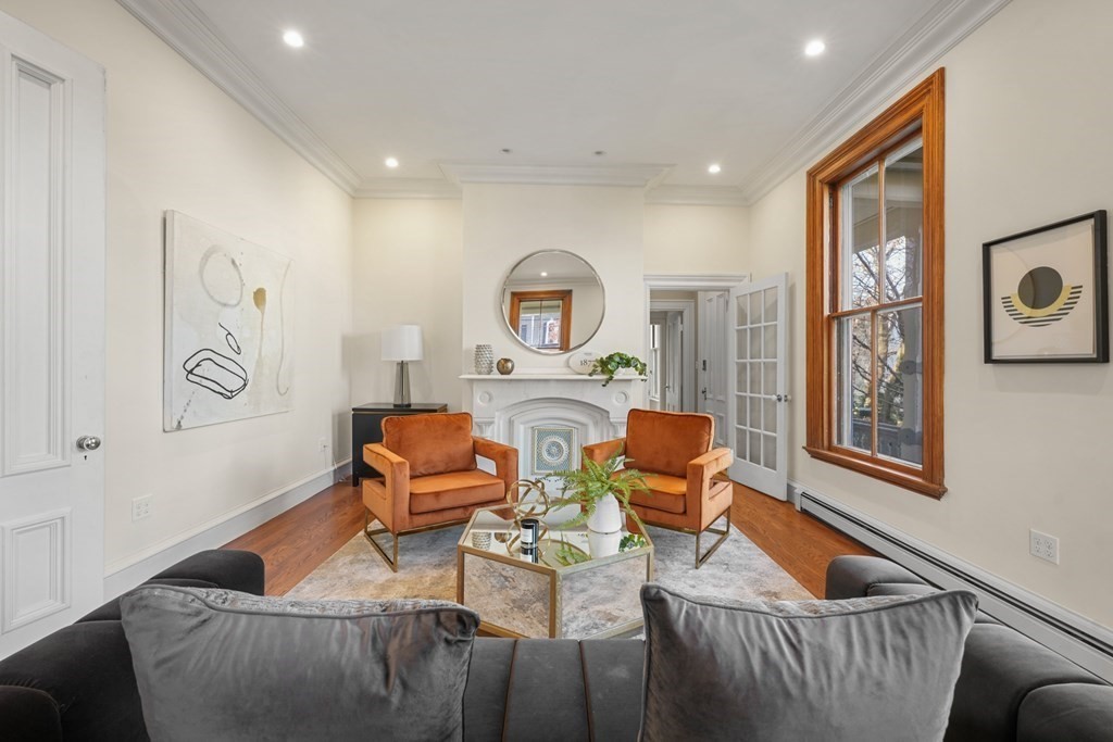 105 Eldredge Street Newton, MA 02458 - Photo 3 of 42 a living room with furniture and a window