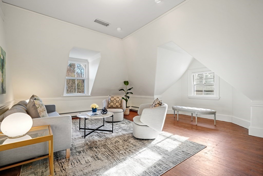 105 Eldredge Street Newton, MA 02458 - Photo 31 of 42 a living room with furniture a rug and a wooden floor