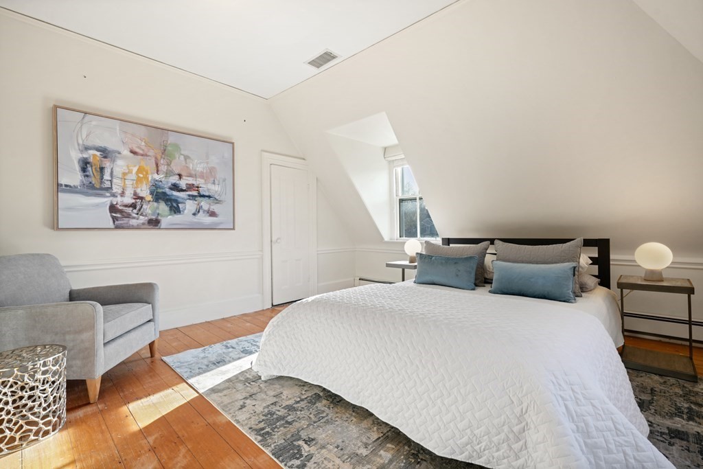 105 Eldredge Street Newton, MA 02458 - Photo 37 of 42 a bedroom with a bed and a couch