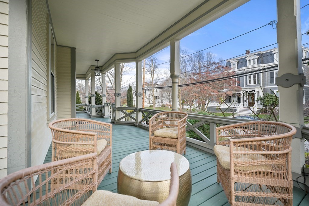 105 Eldredge Street Newton, MA 02458 - Photo 38 of 42 a living room with furniture a large window and wooden floor