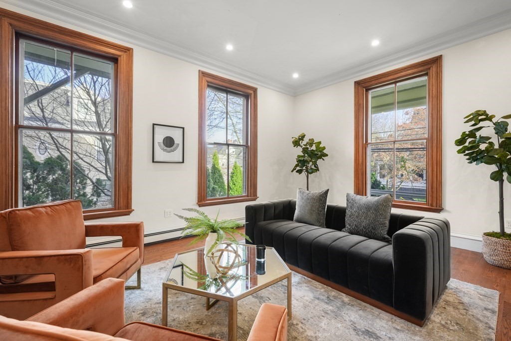 105 Eldredge Street Newton, MA 02458 - Photo 5 of 42 a living room with furniture and a large window