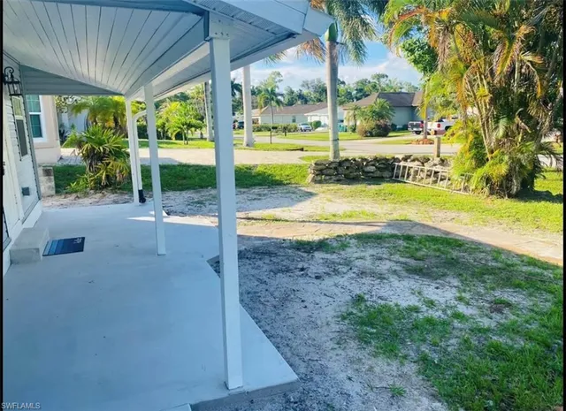 a view of a swimming pool with a porch