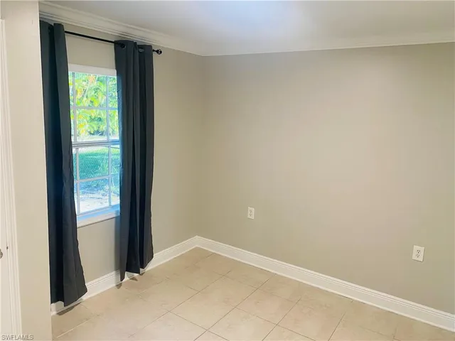 a view of an empty room and window