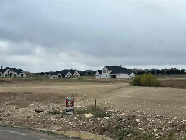 a lake view with tall trees