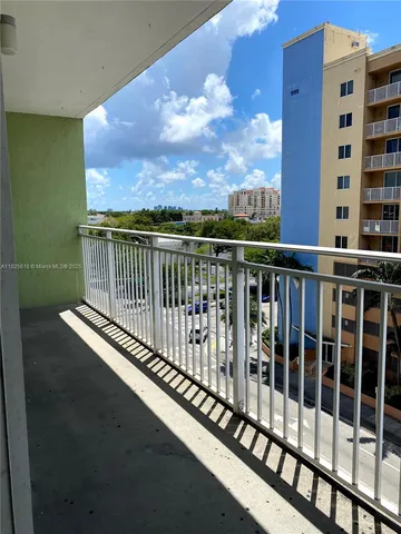 a view of balcony with furniture