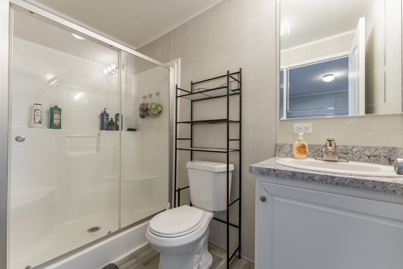 1036 Lunga Drive Round Lake, IL 60073 - Photo 15 of 31 a bathroom with a granite countertop sink toilet and shower